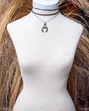 Jericho Layered Squash Blossom Fashion Necklace displayed on mannequin in front of wheat background.