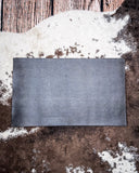 Doormat backside displayed on cowhide.