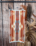 Pecos Towels displayed on rode in front of wood and wheat backdrop.