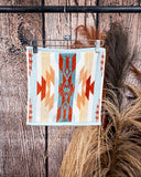 Pecos Towels displayed on rode in front of wood and wheat backdrop.