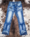 Turquoise Boot Stitch Bootcut Jeans displayed on cowhide.