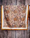 Wild rag displayed on a bar on a wood backdrop.