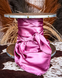 Wild rag in front of a textured background