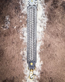 Leather strap with floral design on a fur background