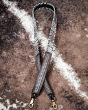 Floral purse strap on brown cowhide