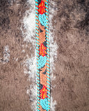 Leafy floral design of a purse strap