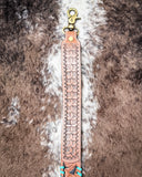 Snap of a purse strap on cowhide