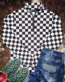 pullover on cowhide rug with shoes and pants 