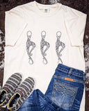 T-shirt on Cowhide rug with shoes and Jeans
