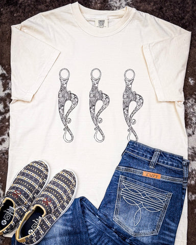 T-shirt on Cowhide rug with shoes and Jeans