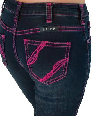 Close-up of the back of dark blue denim jeans with bright pink contrast stitching and embroidery, featuring a visible TUFF brand patch on the back pocket.