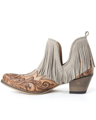 Cowboy boots with fringe and intricate brown leather design on a white background