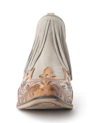 Brown leather shoe with intricate designs on a white background