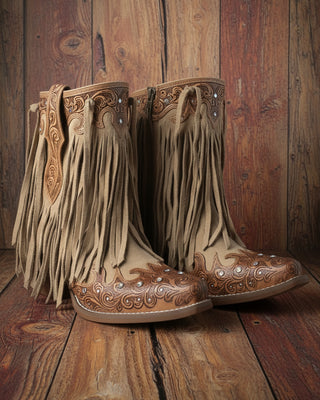 Pair of brown cowboy boots with fringe and intricate designs on a white background