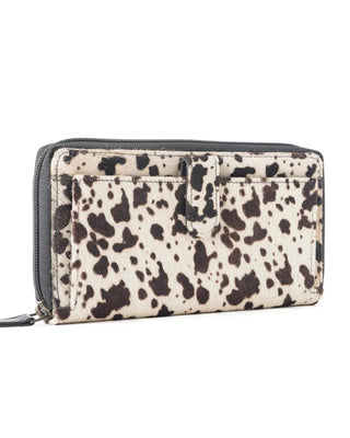 Zip-around wallet with dalmatian print on a white background