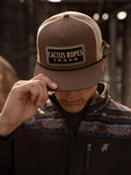 Model wearing Cactus ropes hat looking down holding the bill of the hat