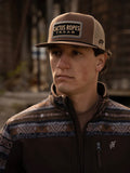 Model wearing Cactus ropes hat looking off into the distance
