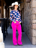 Model wearing jeans and rodeo top.