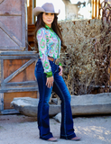 Model wearing jeans and rodeo top.