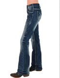 Front view of model wearing boot cut jeans