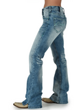 Front view of model wearing boot cut jeans