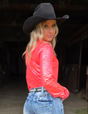 Back view of a cowgirl wearing the Rind and Shine Pullover Button Up in a barn.