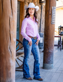 Cowgirl standing next to pillars wearing the Sugar and Cinch Pullover Button Up.
