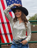 Front view of a model wearing the  Shiny Side Up Pullover in front of the American flag and a fence.