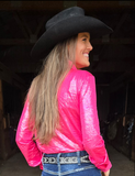 Back view of a model wearing the Pink Lightning Pullover in a barn.