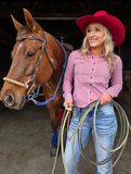 Model wearing the Sugar and Grit Pullover in front of a horse.
