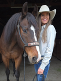 Model wearing the Desert Hound Pullover next to a horse.