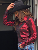 A model wearing the  Spurfire Pullover inside of a trailer.
