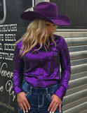 A model wearing the  Spurfire Pullover Button Up in front of a trailer.