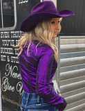 Back view of a model wearing the  Spurfire Pullover Button Up in front of a trailer.