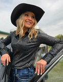 Front view of a model wearing the Spurfire Pullover Button Up in front of a truck.