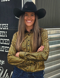 Model posing in front of a trailer wearing the Spurfire Pullover Button Up.