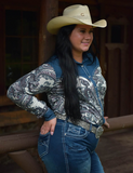 Model posing in the Ranch Ready Pullover Button Up while leaning on a hand rail.