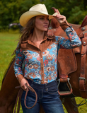 Front view of a model posing in the Ranch Ready Pullover Button Up in front of a horse.