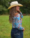 Back view of a model posing in the Ranch Ready Pullover Button Up in front of a horse.