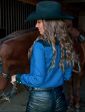 Back view of a model wearing the Ranch Ready Pullover Button Up next to a horse.