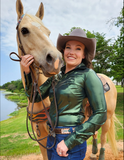 A model wearing the Emerald Blaze Pullover Button Up in front of a horse.