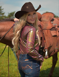 A model wearing the Garnet Glow Pullover Button Up next to a horse.