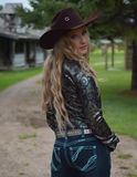Back view of a model wearing the Midnight Mirage Pullover Button Up in a park.