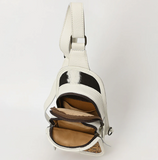 Stock photo of the inside/pockets of the Ridge Bloom Tooled Sling Bag - Ivory.