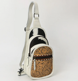 Stock photo of the front of the Ridge Bloom Tooled Sling Bag - Ivory.