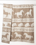 Blanket with horse and cowboy hat pattern on a white background