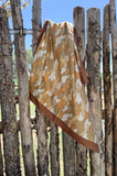 wild rag draped on a wood fence