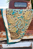 wild rag draped on a rusty truck