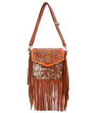 The Sierra Azul Hair on Hide Fringe Crossbody Bag in a white back ground.