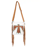 The Talon Hair on Hide Fringe Crossbody Bag in a white back ground.